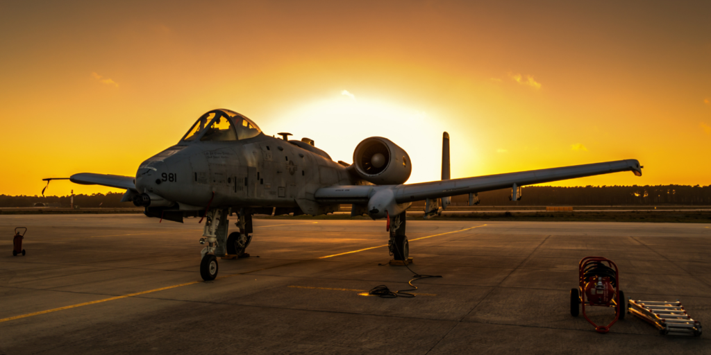 Image of a fighter jet in a sunset