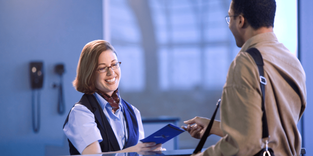 Check in agent at airport accepting a passengers passport