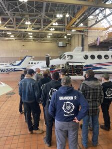 Students at BAVTS Visit to Scott Richards Aviation with VelocityR Aviation - in hanger looking at aircrafts